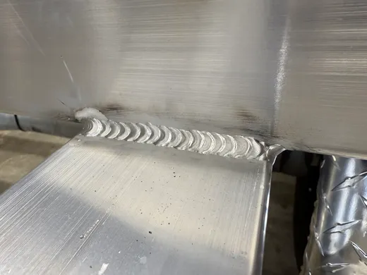 Close-up of a clean aluminum weld bead by RedLine in Ocala, FL